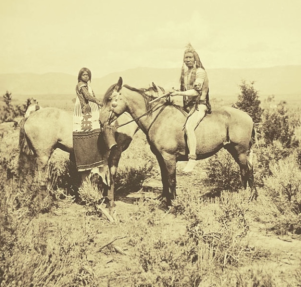 Ute warrior and girl along_White_River_-_Jack_Hillers_-_1873