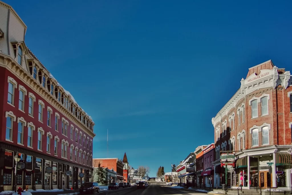 Historic hotel buildings on Harrison Avenue in Downtown Leadville, Blue skies and sunny day.