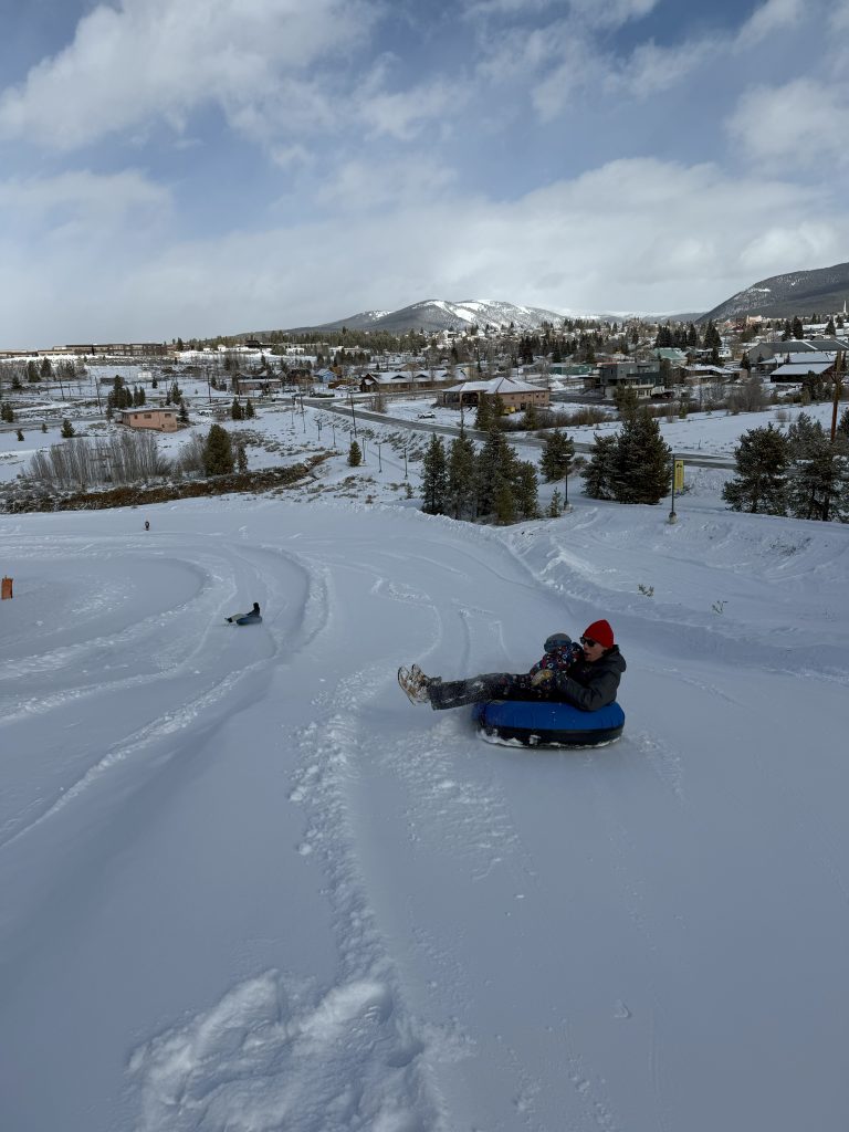 person snow tubing.
