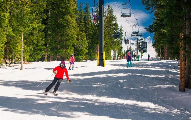 people skiing down a hill.