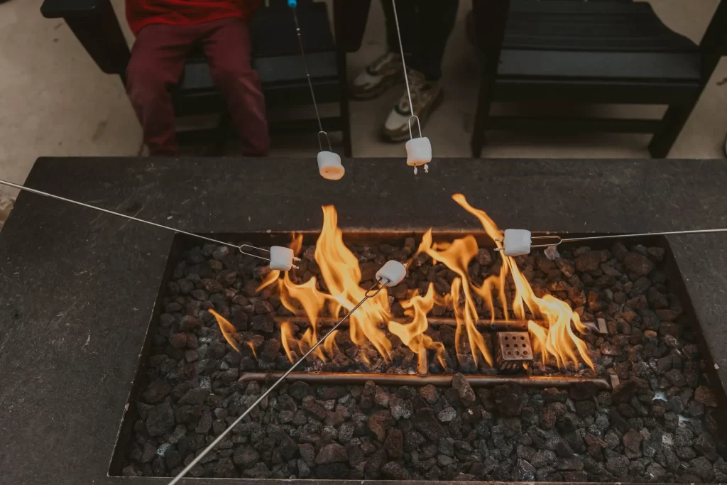 Roasting marshmallows over a propane fire pit at Timberline Lodge
