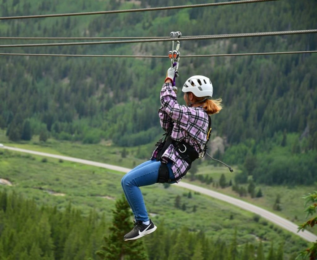 women zip lining.